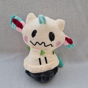 Cream and Black Stuffed Animal Toy